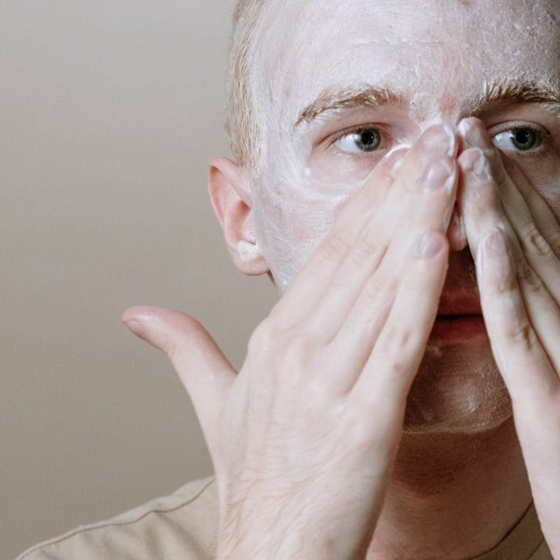 Man applying skincare products