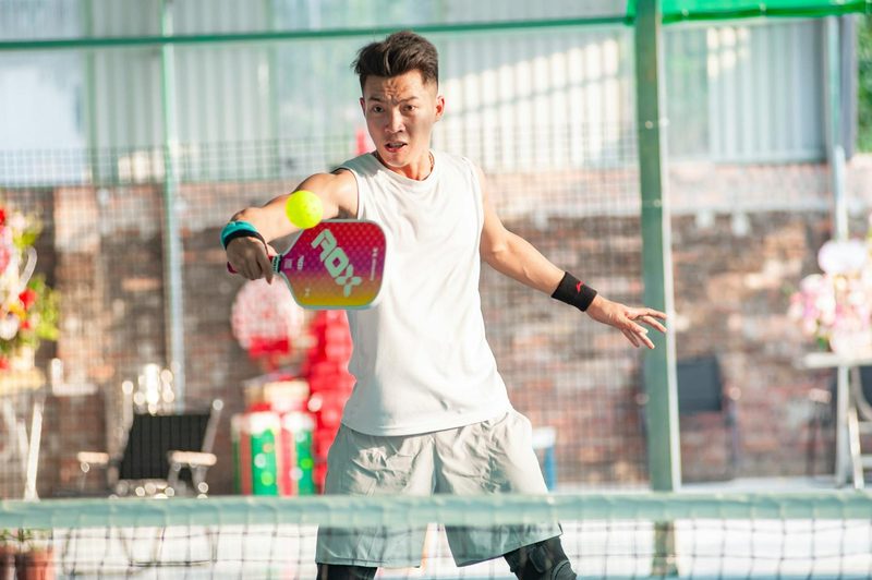 man playing pickleball