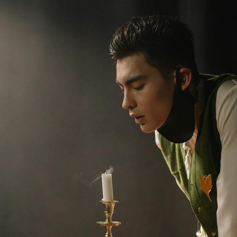 Man blowing out candles
