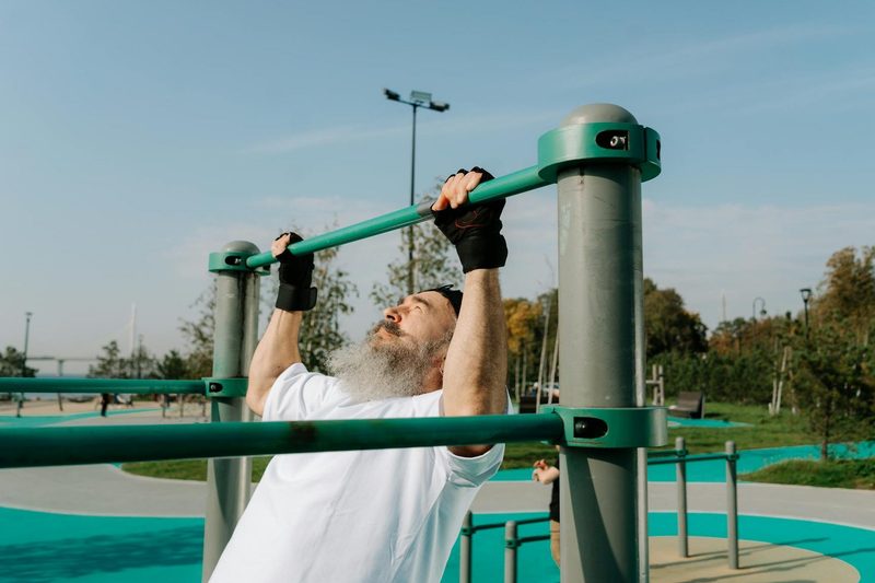 older man doing pull ups