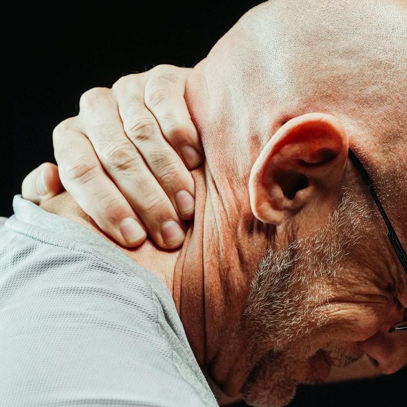 Man with neck pain muscle spasm cramp