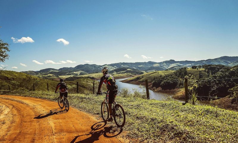 man cycling on road