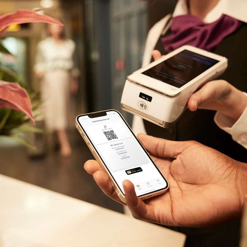 Person scanning Priority Pass airport lounge membership on phone