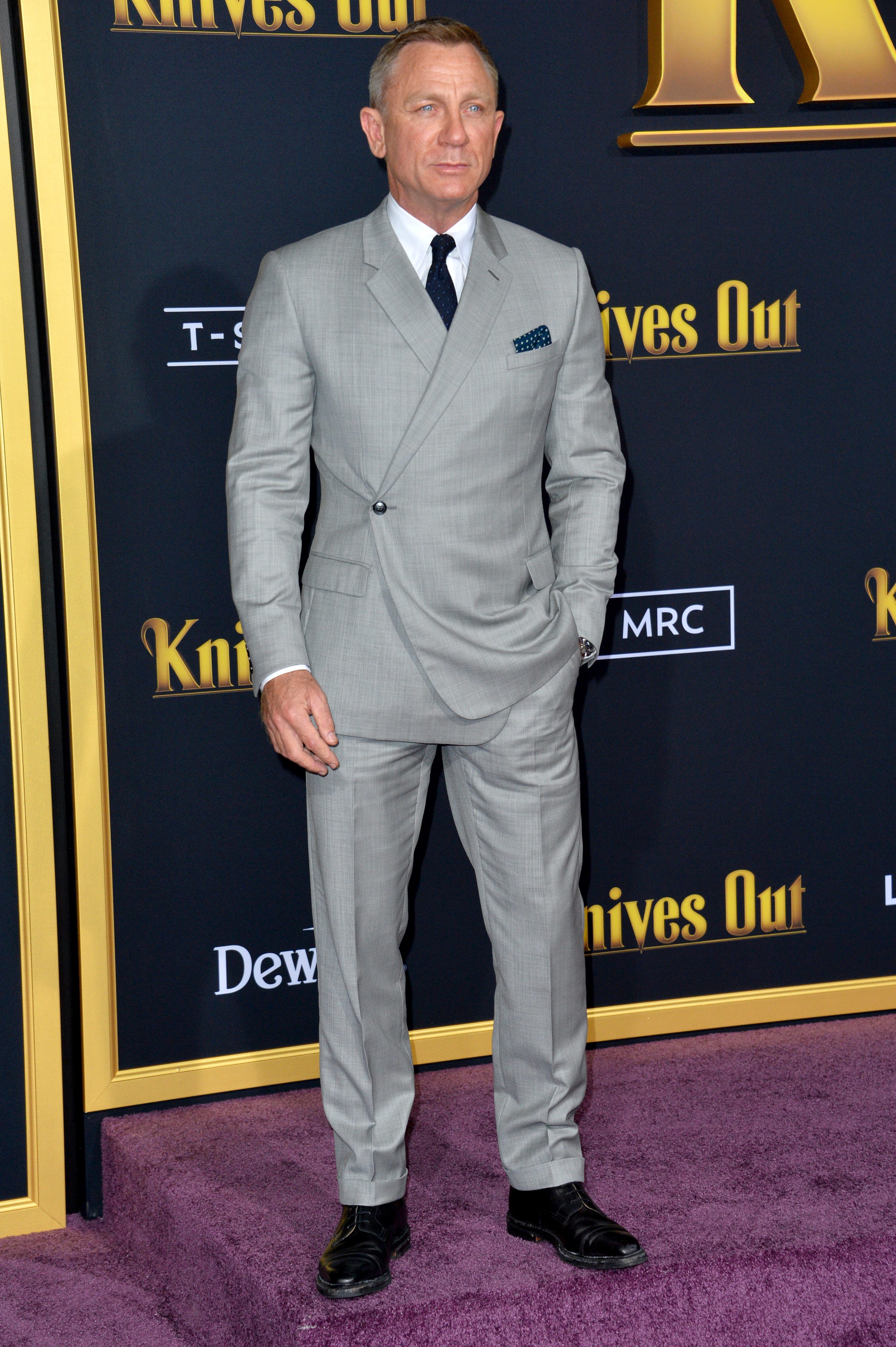 Daniel Craig takes the red carpet by storm in a light grey suit