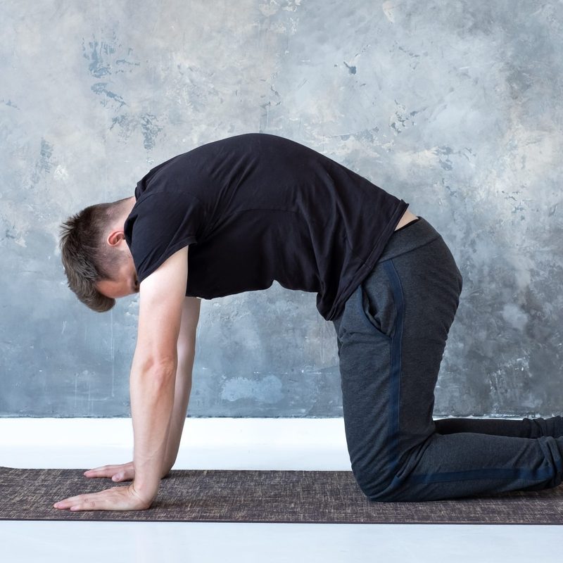 Man doing cow pose exercise yoga