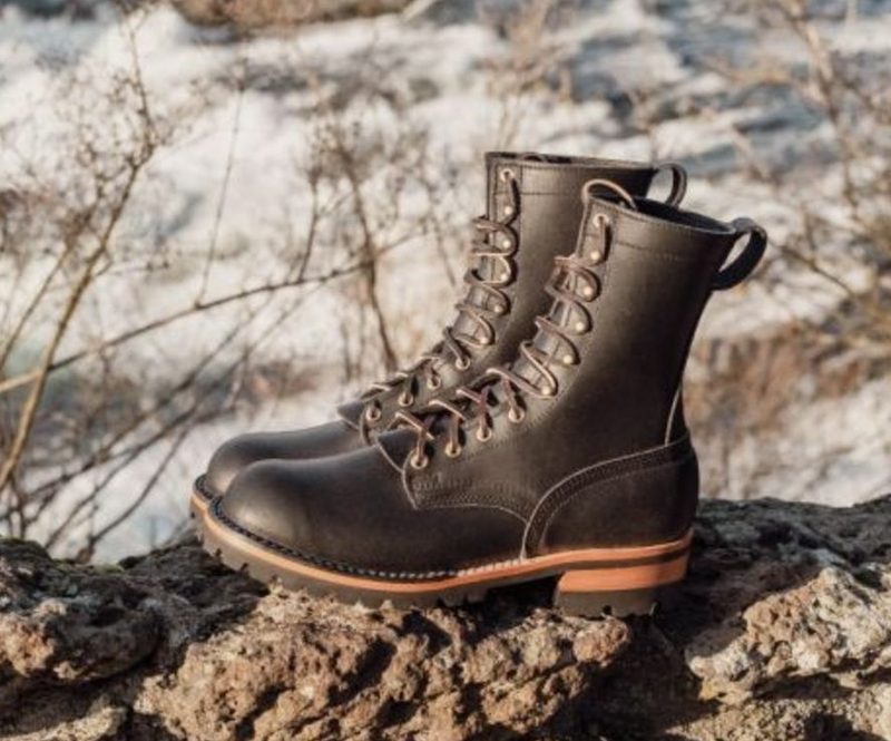 black boots sitting on rock