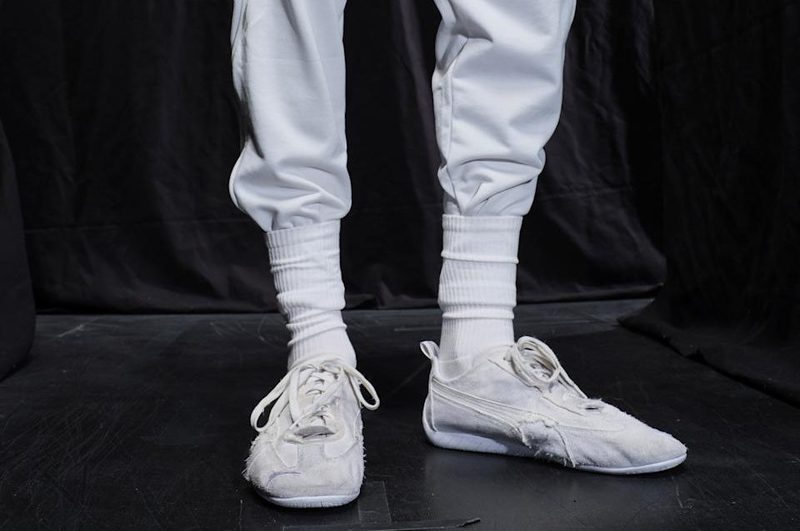 model wearing puma x balenciaga sneaker