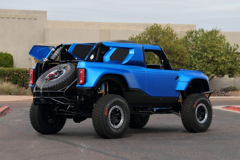 Rear 3/4 view of an electric blue 2023 Ford Bronco Desert Racer.