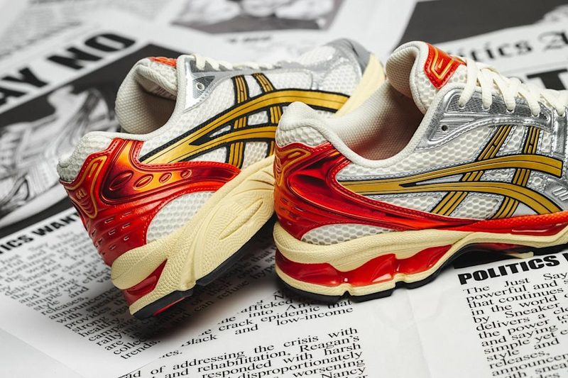 asics sneakers on newspaper