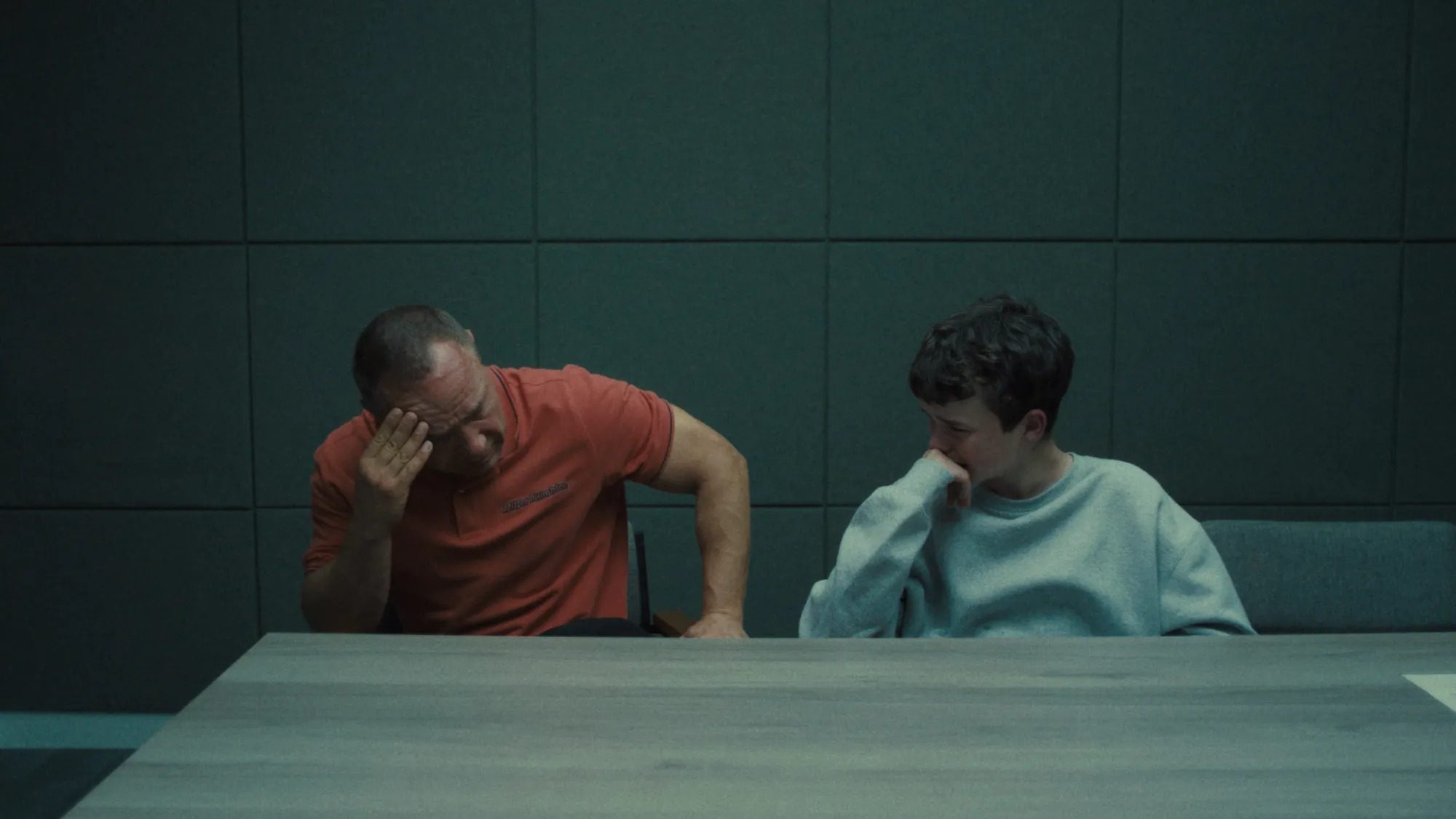 A father and Child in an interrogation room