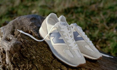 new balance sneaker on log