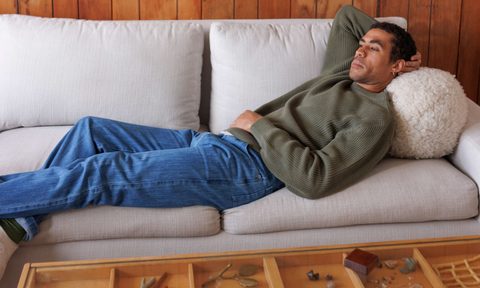 Alex Crane sweater on the couch