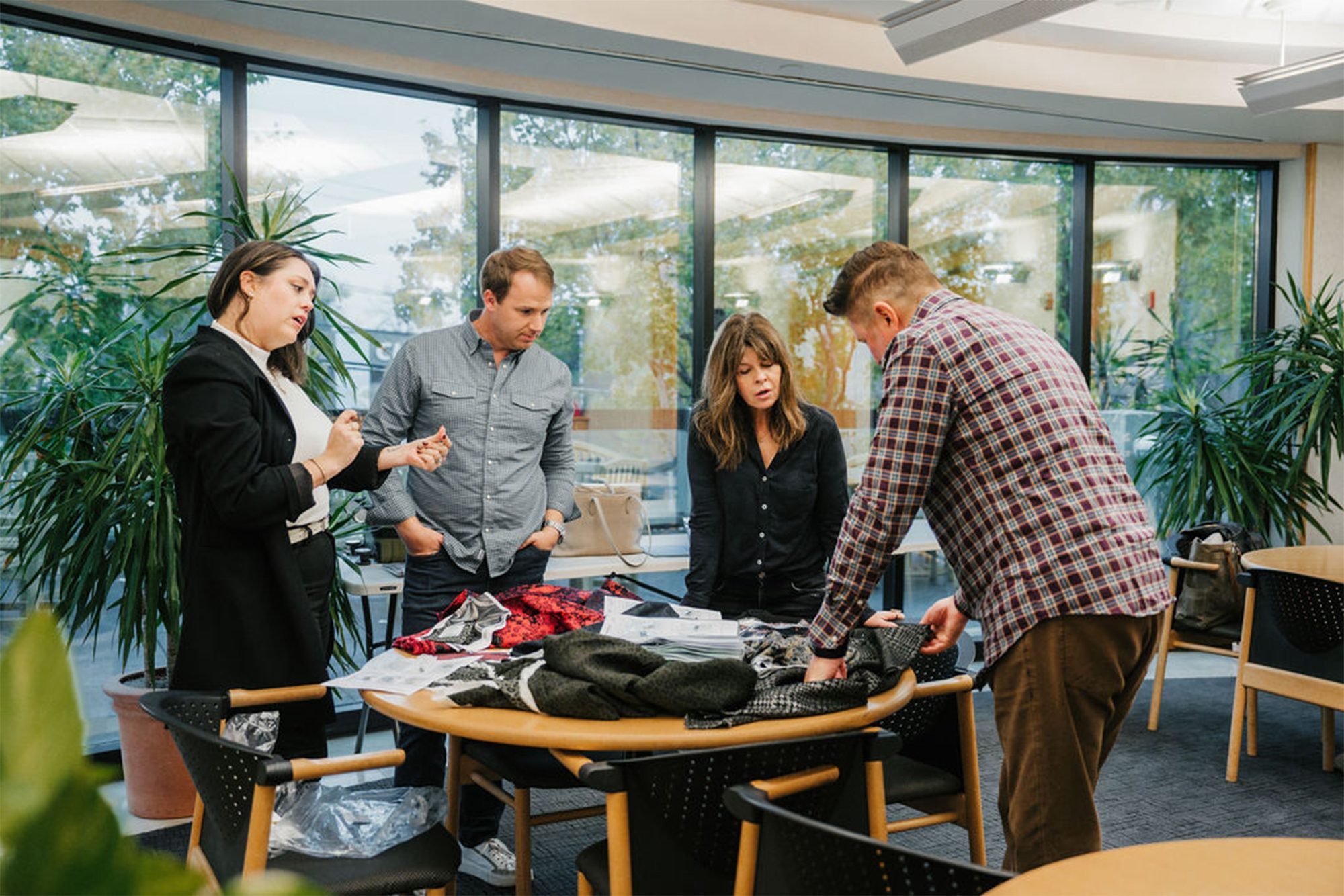 Snaps team around a table