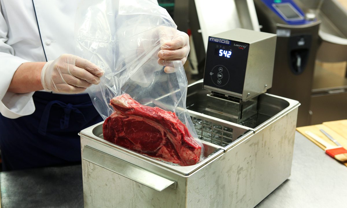 Chef preparing sous vide steak