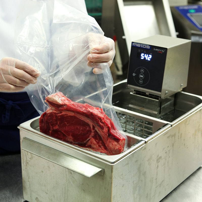 Chef preparing sous vide steak