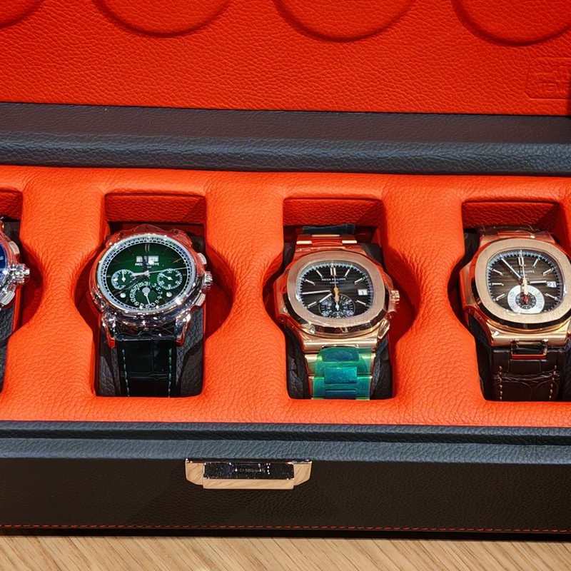 A case containing four rare watches