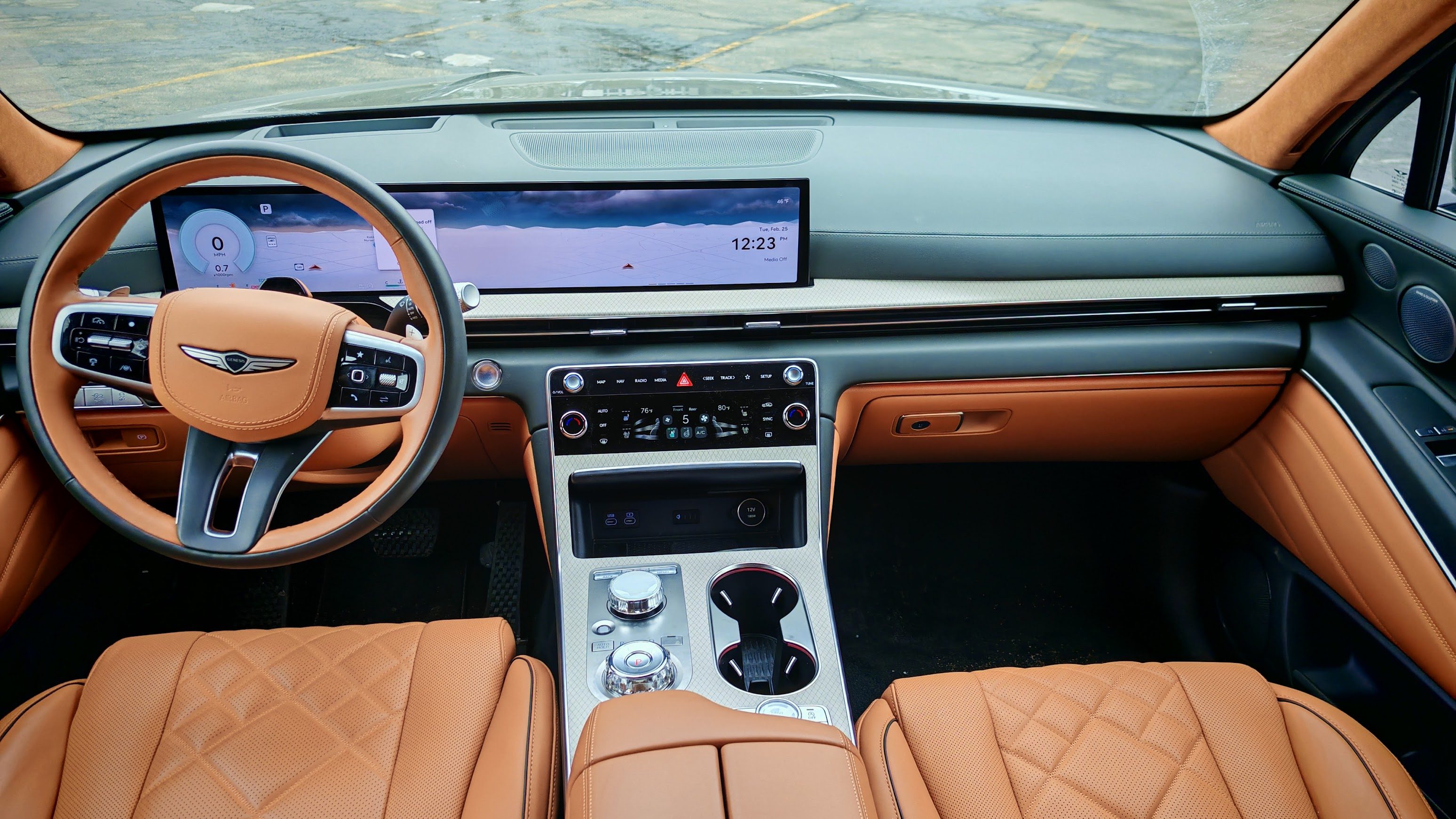 Interior view of a Genesis GV80 Prestige dashboard and wheel