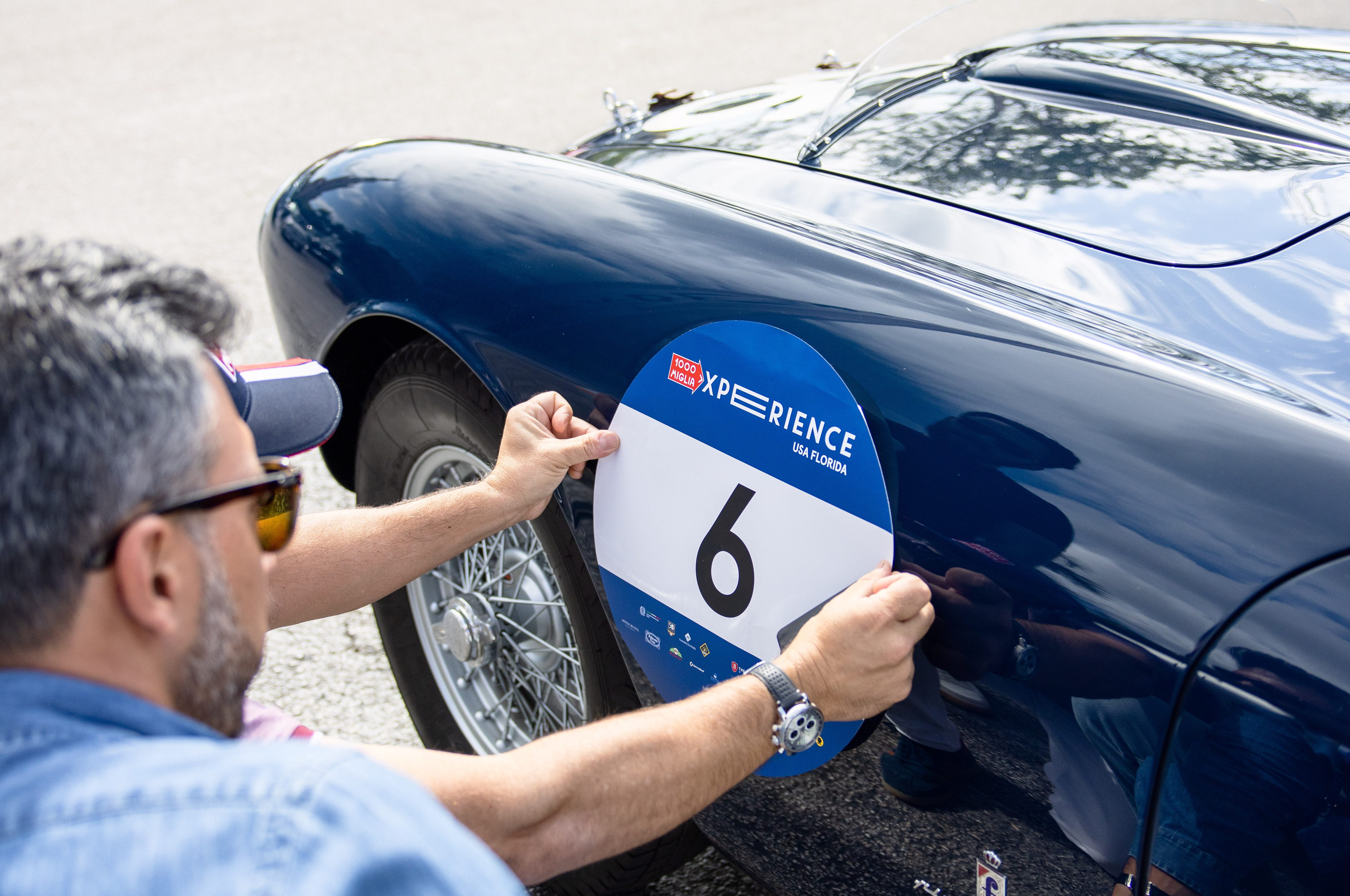 A number six being applied to a Ferrari 250MM before the 1000 Miglia Experience Florida