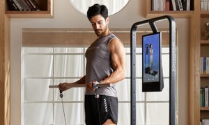 Man barbell workout at home Speediance gym machine