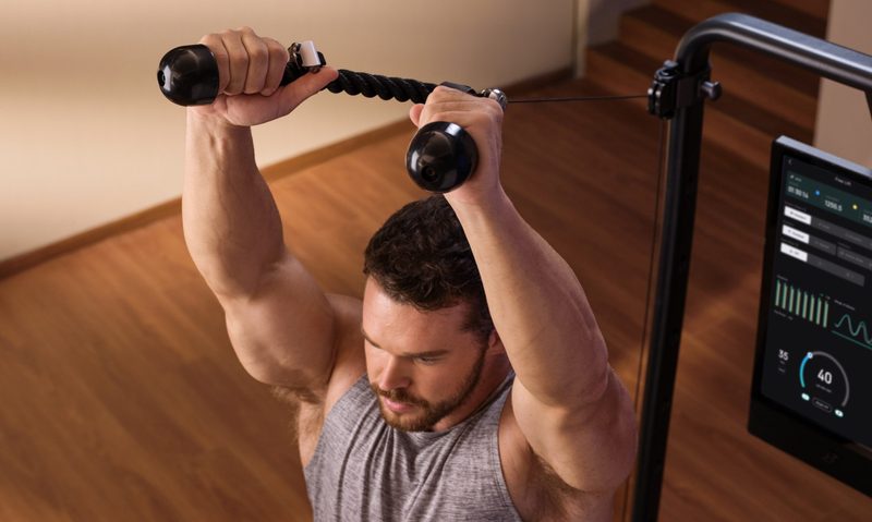 Man exercising with the Speediance Gym Monster 2 machine Bluetooth ring