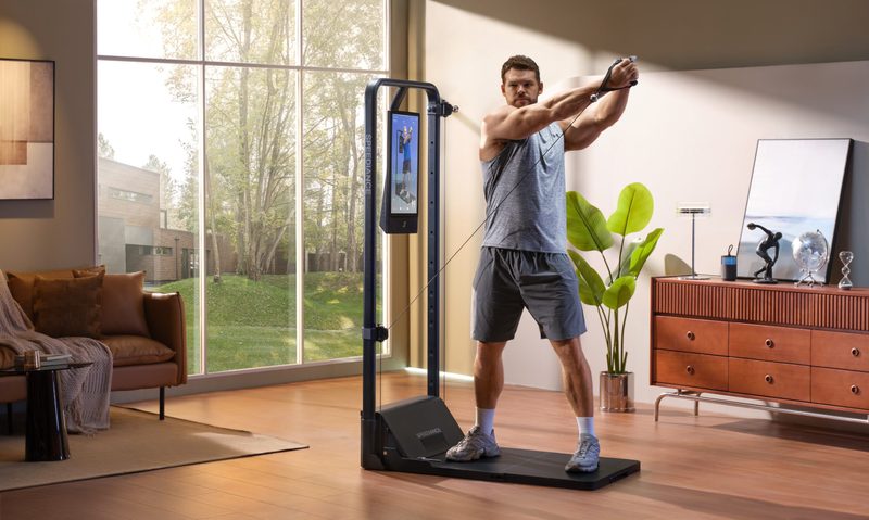 Man working out at home on Speediance gym machine