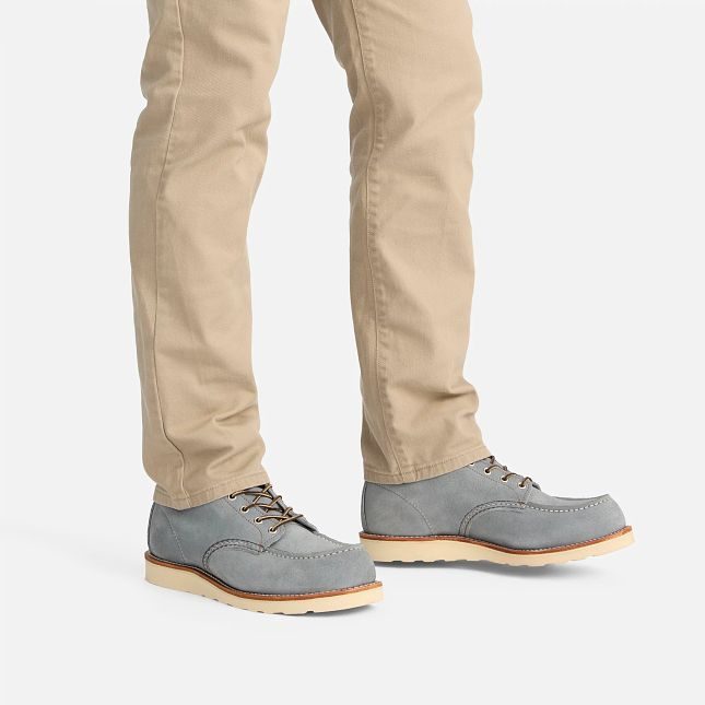 man wearing pastel blue boots