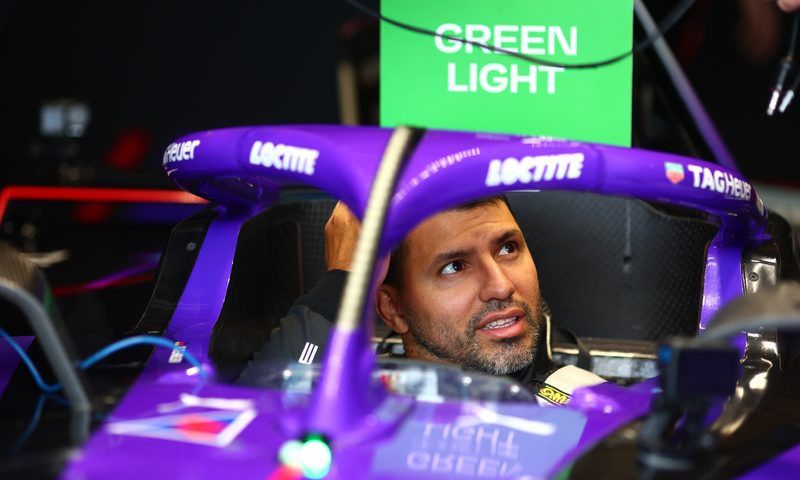 Sergio Aguero in a race car.