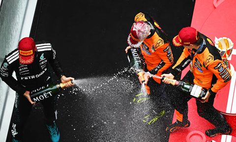 The 2025 Chinese Grand Prix winners celebrate on the podium.