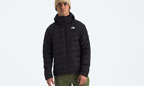A model wearing The North Face Men's ThermoBall Hoodie 2.0.