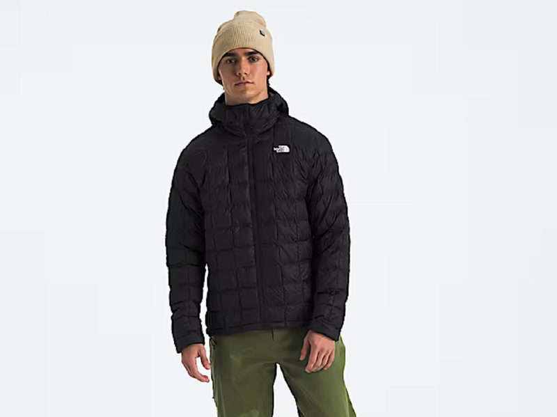 A model wearing The North Face Men's ThermoBall Hoodie 2.0.