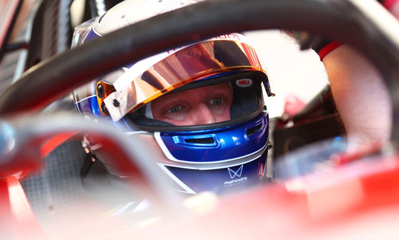 Theo Baker in a race car.