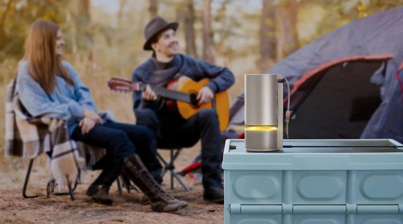 A man playing the guitar next to the XGIMI projector in ambient sound mode