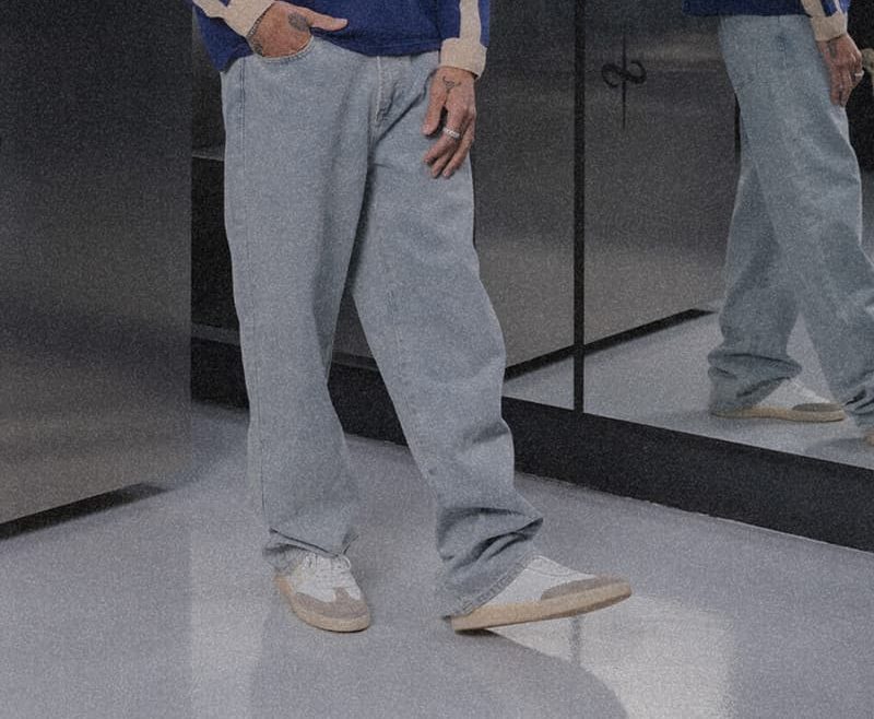 model wearing jeans and trento sneaker