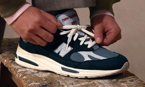 man tying new balance made in uk sneakers