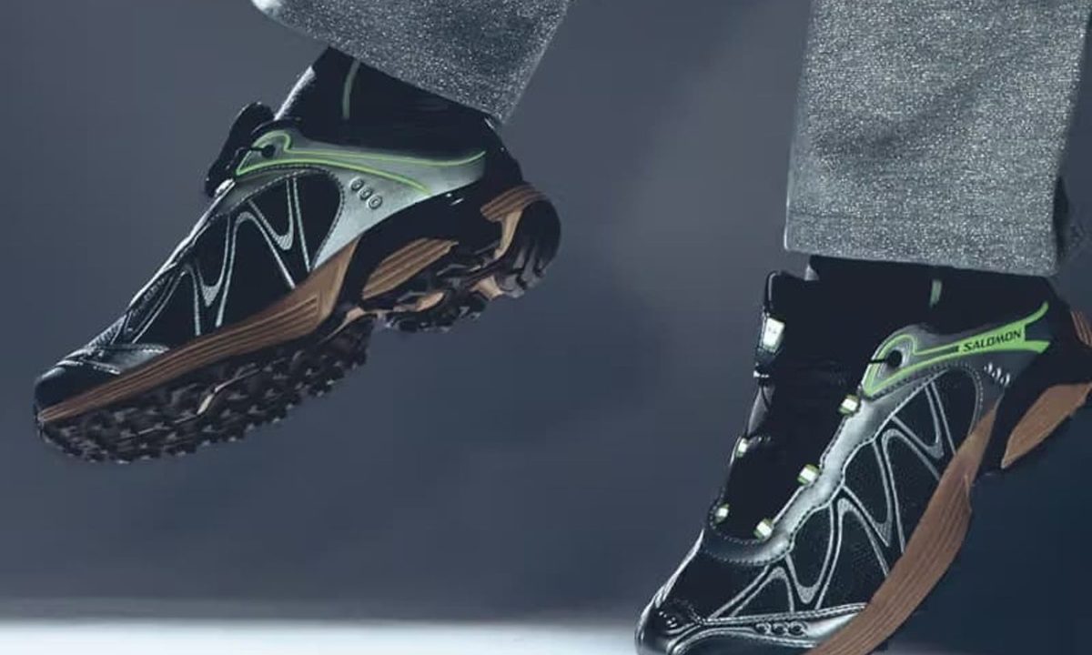model in midair with salomon sneakers