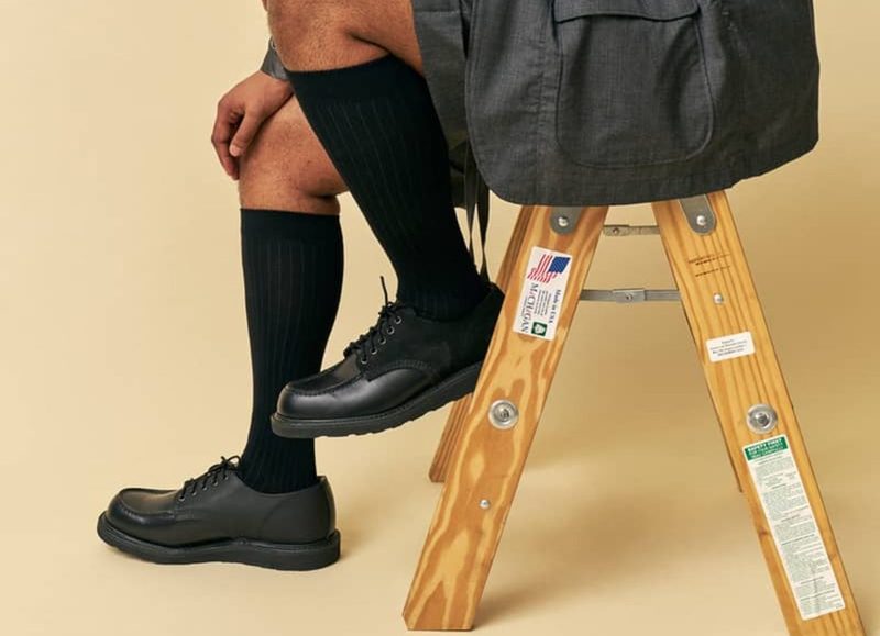 model wearing black oxford shoes