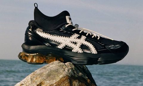 sneaker placed on rock