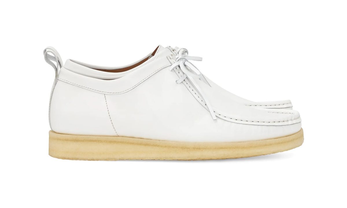 side profile of white mocassin shoe