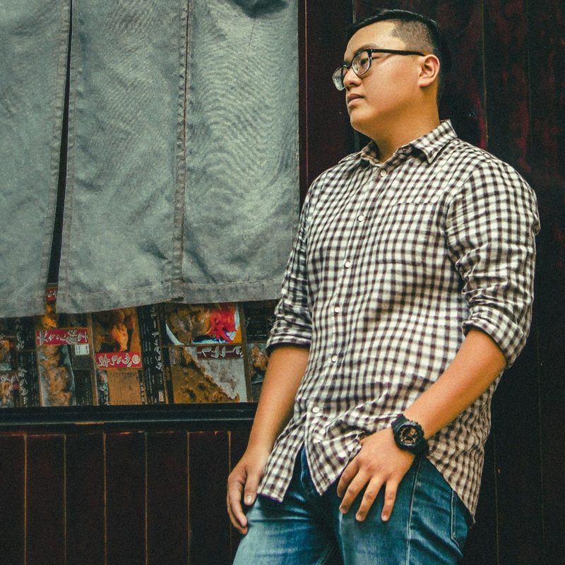 Man leaning against wall