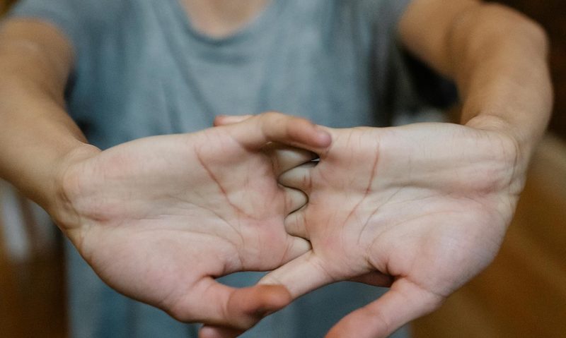man stretching his hands forearm stretch wrist