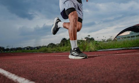 man running on track