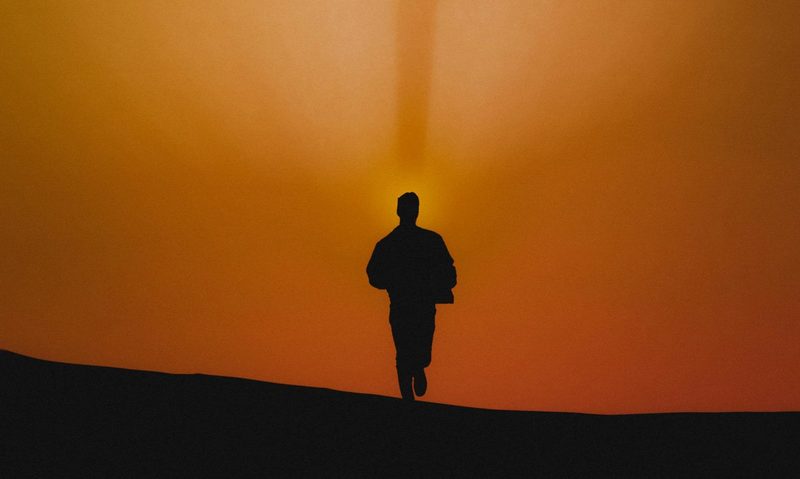 man running sunset silhouette