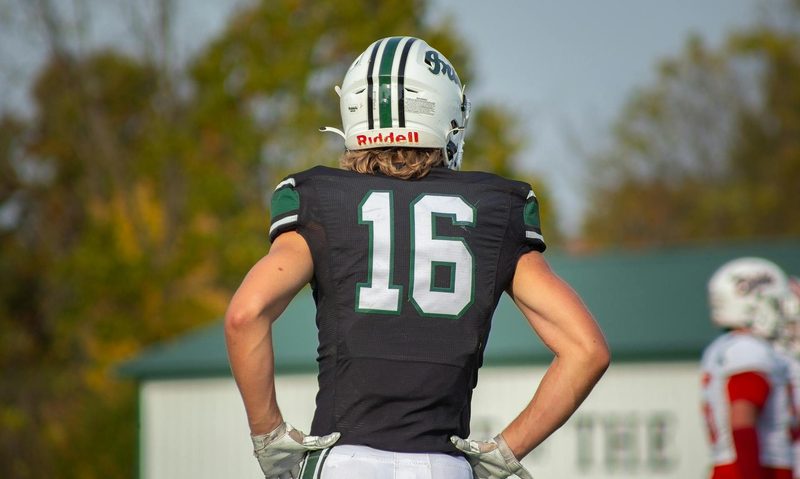 teenage athlete on field wearing helmet