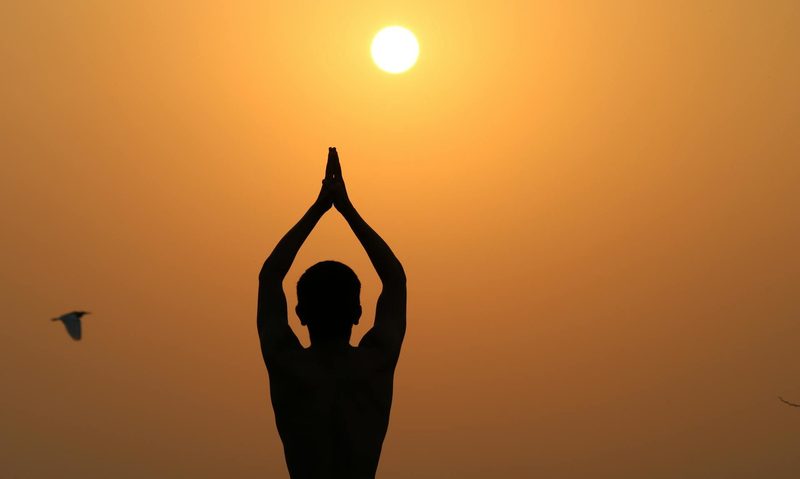 man yoga pose stretching sun salutation
