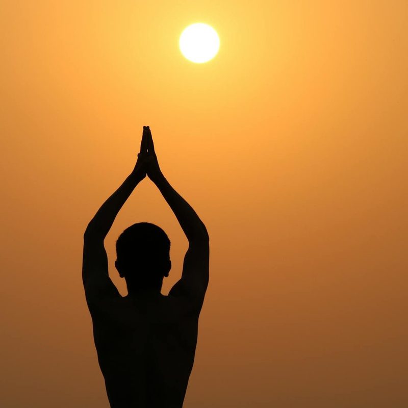 man yoga pose stretching sun salutation