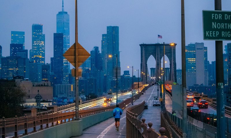 man running at sunset in the evening in the city jogging