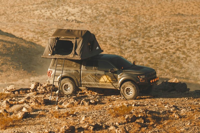Roof Space 4 rooftop tent mounted on a pickup truck in the desert.