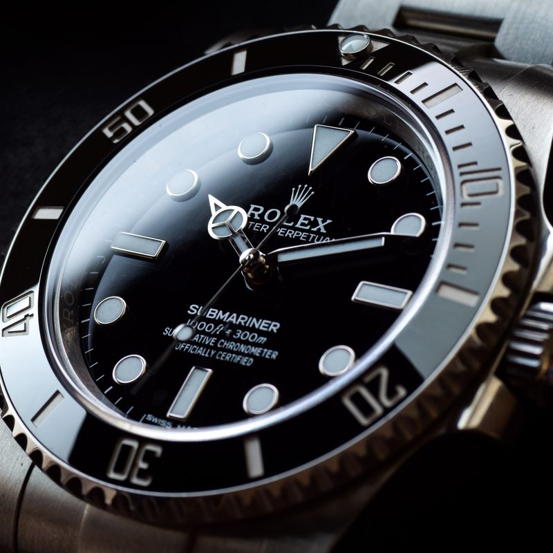 A Rolex Submariner with a black background