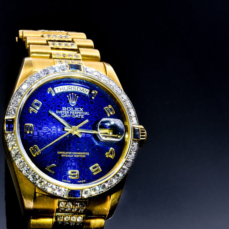 Vintage gold Rolex Day Date with diamond and sapphire bezel