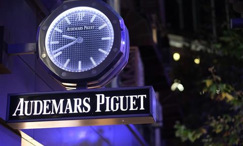 Close up Audemars Piguet store sign at night.